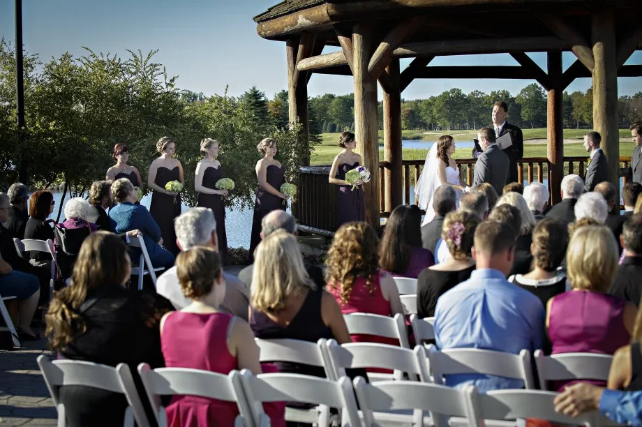 Guests attending an outdoor gazebo wedding ceremony at Solitude Links